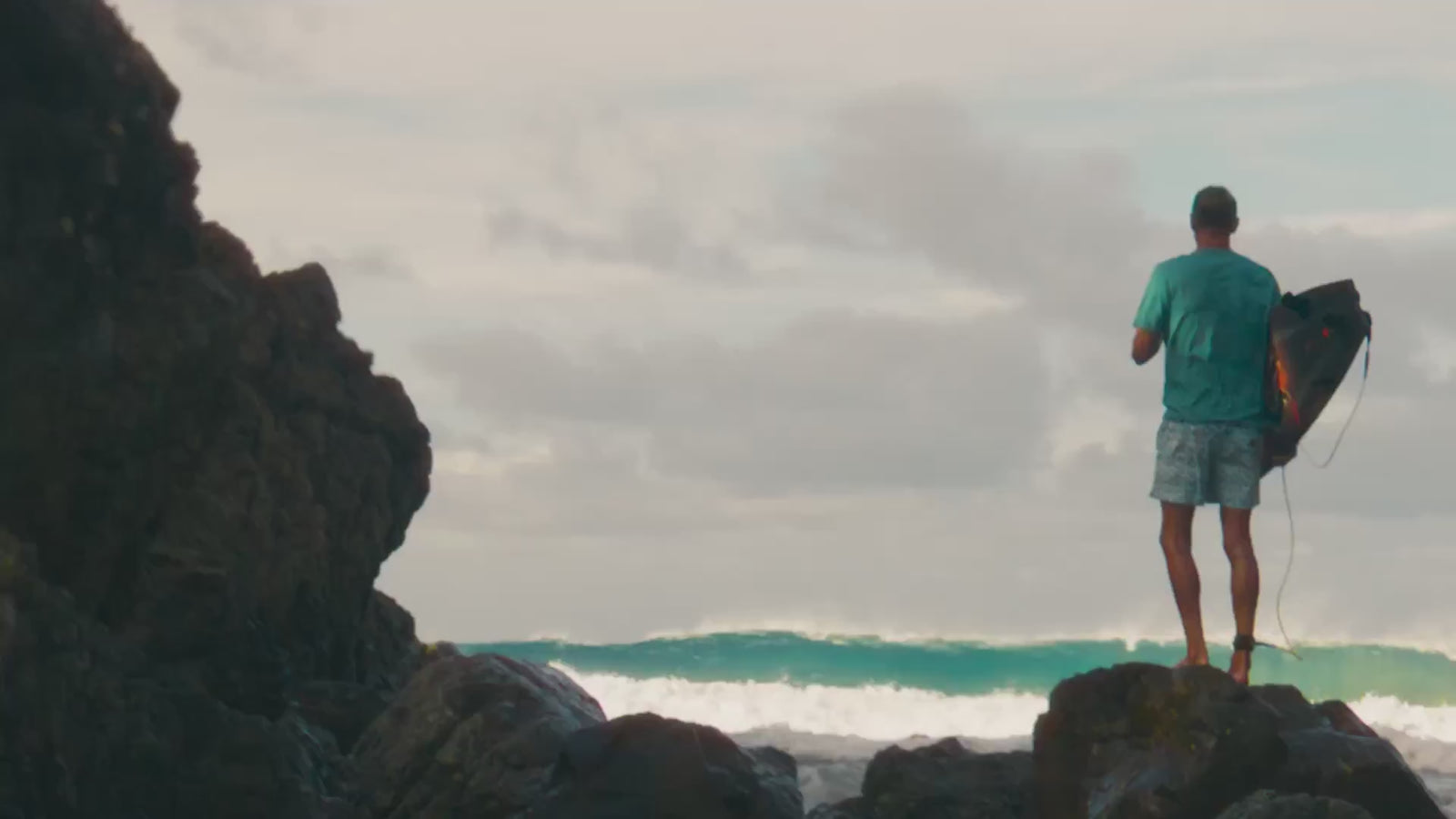 lifestyle footage of male surfers wearing Faherty tee shirts